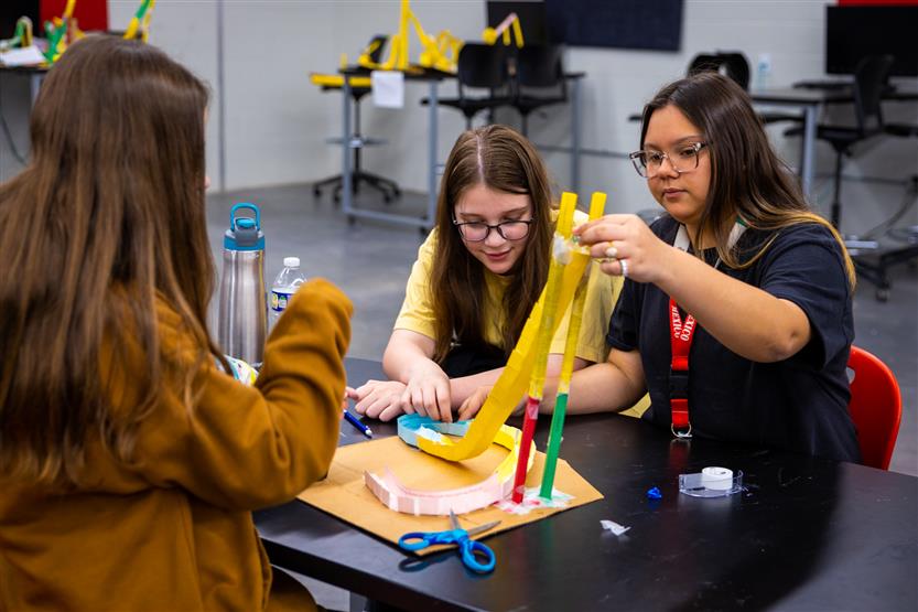 Students build paper rollercoasters